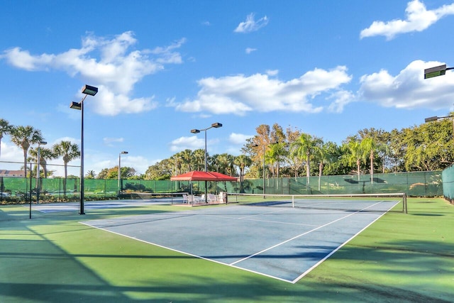 view of sport court with fence