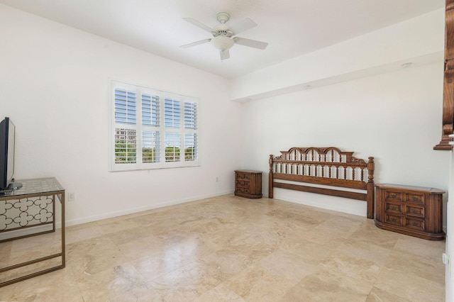 bedroom with ceiling fan and baseboards