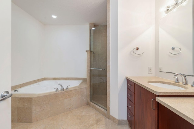 bathroom with vanity, a shower stall, a bath, and tile patterned floors