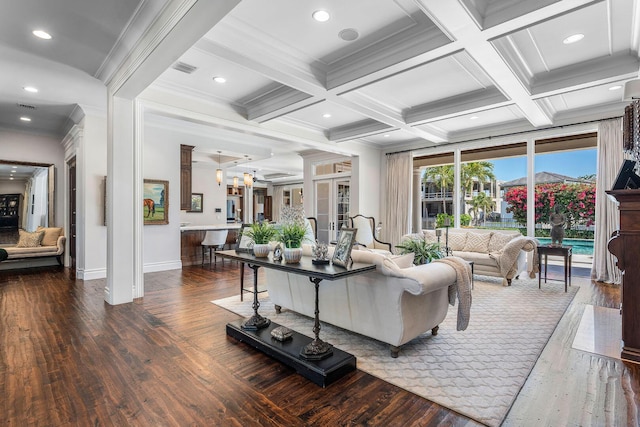 living room featuring hardwood / wood-style floors, beamed ceiling, coffered ceiling, and ornamental molding