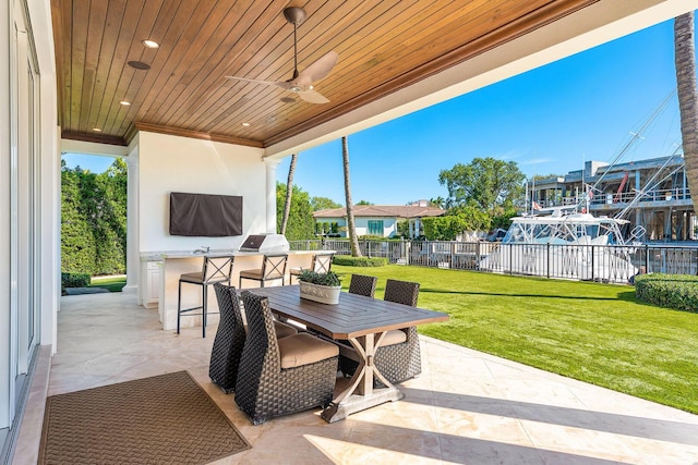 view of patio featuring area for grilling, outdoor dining space, fence, grilling area, and ceiling fan