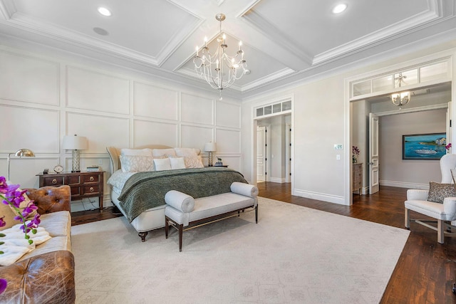 bedroom with a decorative wall, coffered ceiling, crown molding, and an inviting chandelier