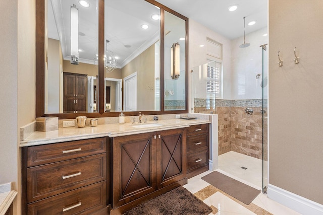 full bath featuring vanity, ornamental molding, recessed lighting, and tiled shower