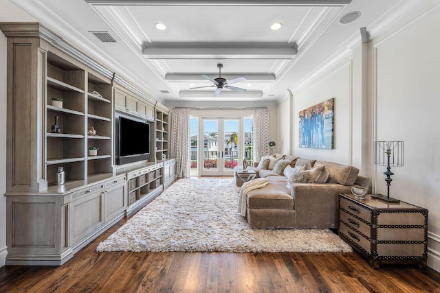 living room featuring visible vents, dark wood-type flooring, ceiling fan, crown molding, and french doors