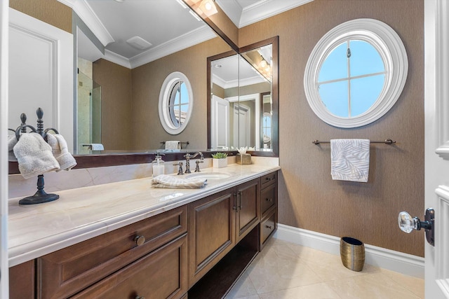 bathroom with vanity, baseboards, a shower stall, crown molding, and tile patterned floors