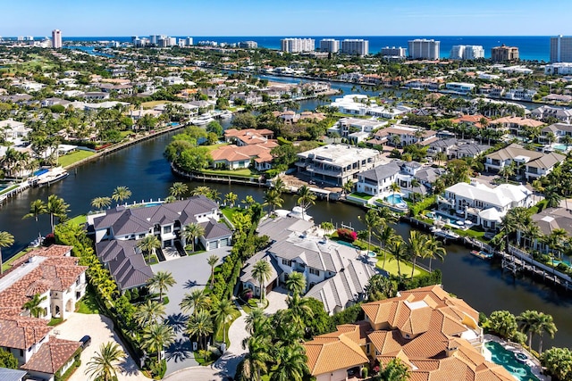 birds eye view of property featuring a residential view and a water view