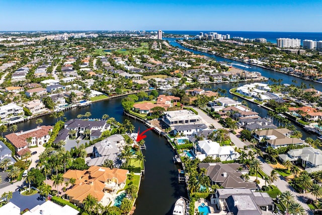 drone / aerial view featuring a residential view and a water view