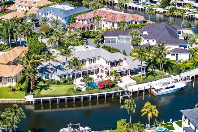 bird's eye view featuring a residential view and a water view