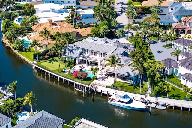 birds eye view of property featuring a residential view and a water view