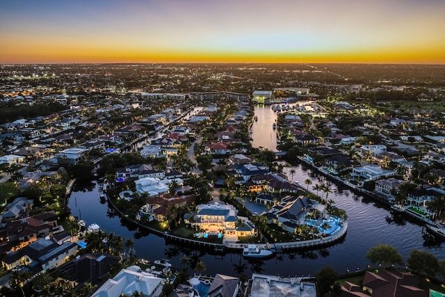 drone / aerial view with a residential view and a water view