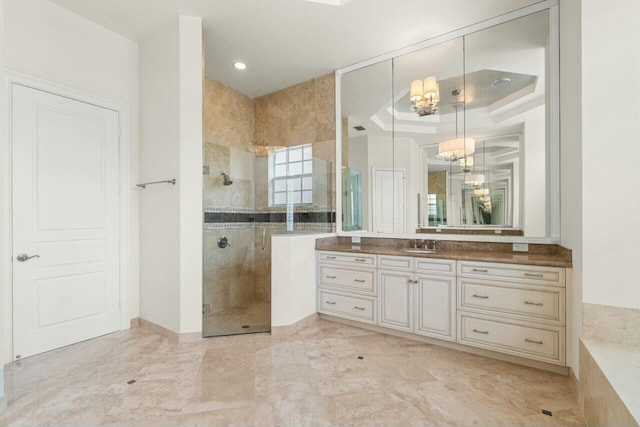 bathroom featuring a stall shower and vanity