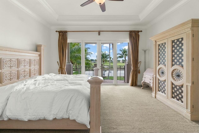 bedroom featuring ornamental molding, access to outside, a raised ceiling, and carpet flooring