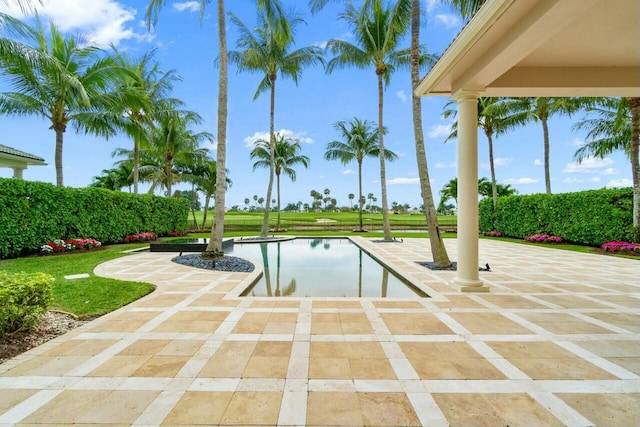 view of swimming pool with a patio