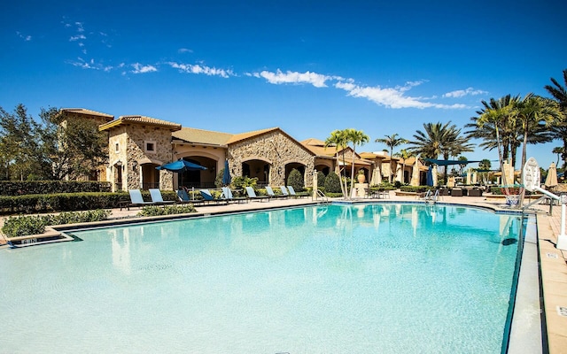 community pool with a patio area