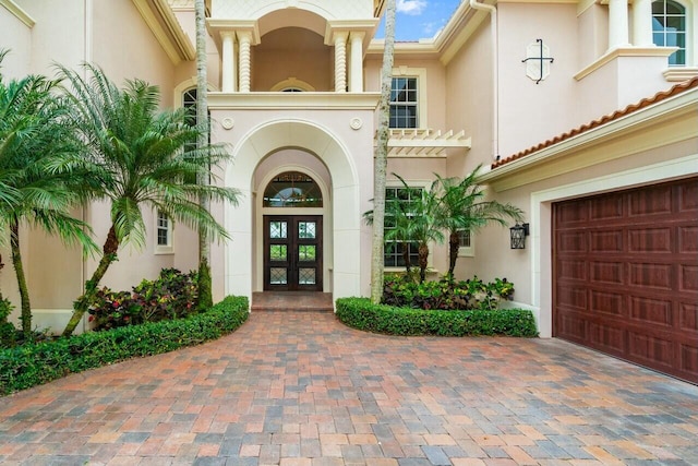 doorway to property with french doors and stucco siding