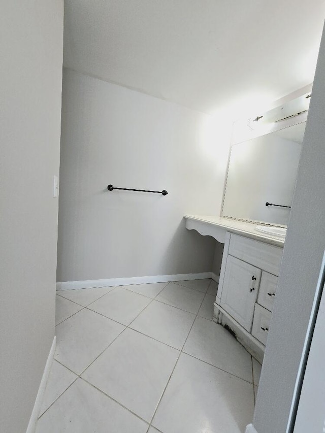 bathroom featuring tile patterned flooring and baseboards