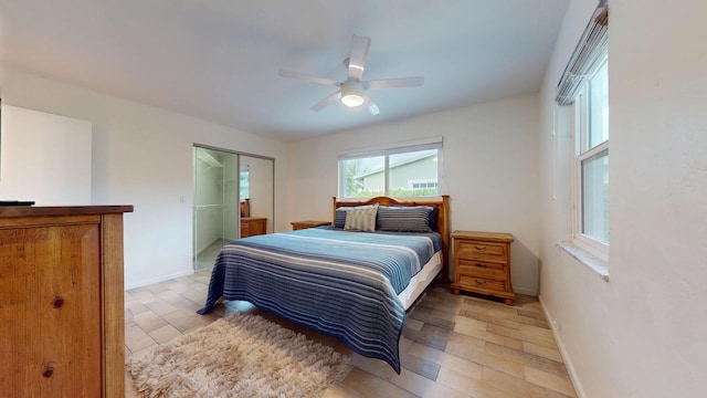 bedroom with ceiling fan and baseboards