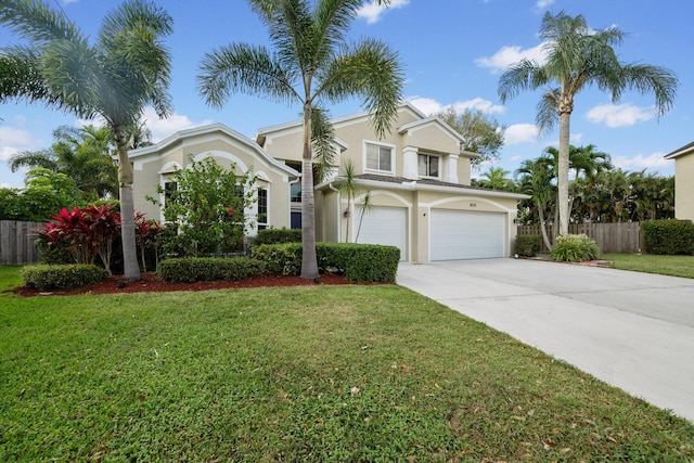 traditional-style house with concrete driveway, fence, a front lawn, and stucco siding