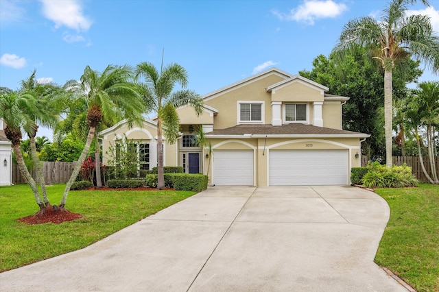 view of front of house featuring stucco siding, driveway, and an attached garage