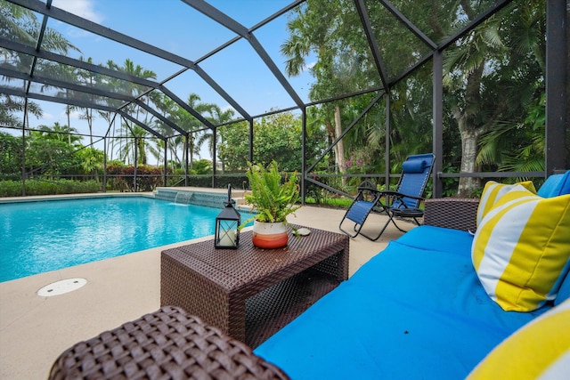 swimming pool featuring a patio and a lanai