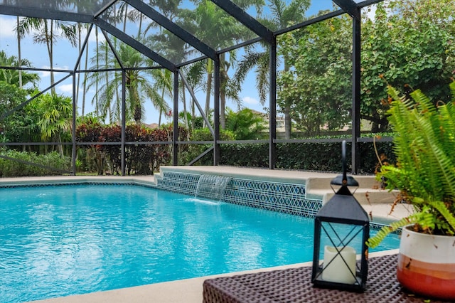 outdoor pool with a lanai and a patio