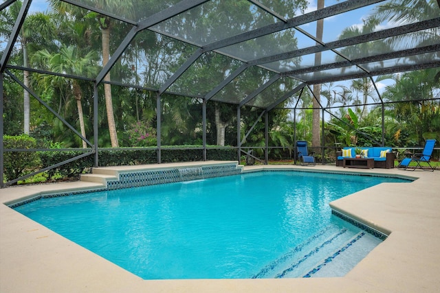 outdoor pool with outdoor lounge area and a patio area