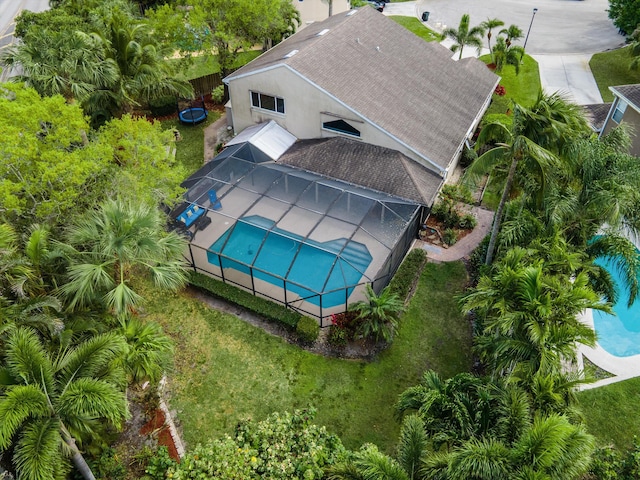aerial view of property and surrounding area with a pool area