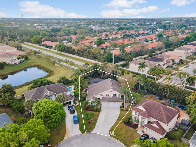 aerial perspective of suburban area featuring property parcel outlined and a nearby body of water