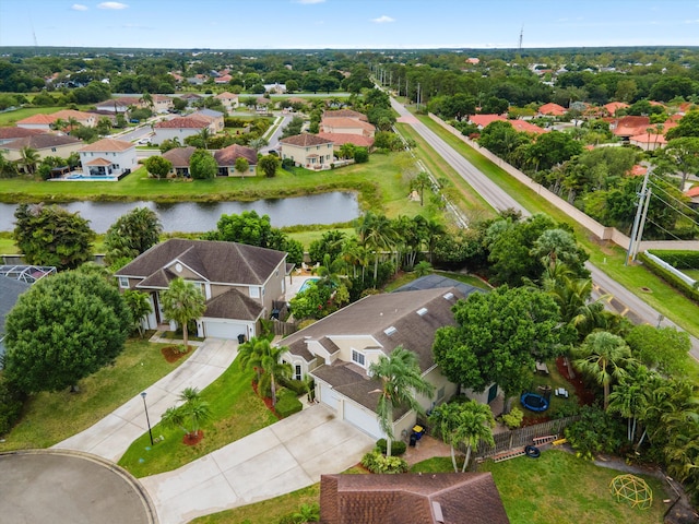 aerial perspective of suburban area featuring a nearby body of water