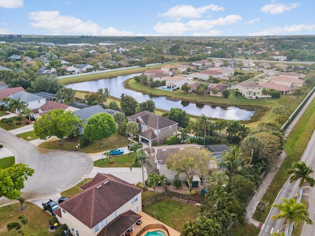 birds eye view of property featuring a residential view and a water view