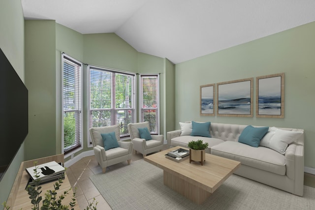 tiled living room with healthy amount of natural light and vaulted ceiling