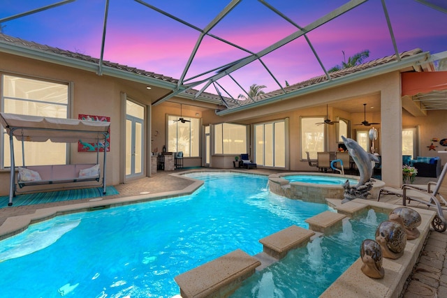 view of swimming pool featuring a patio, ceiling fan, and a pool with connected hot tub