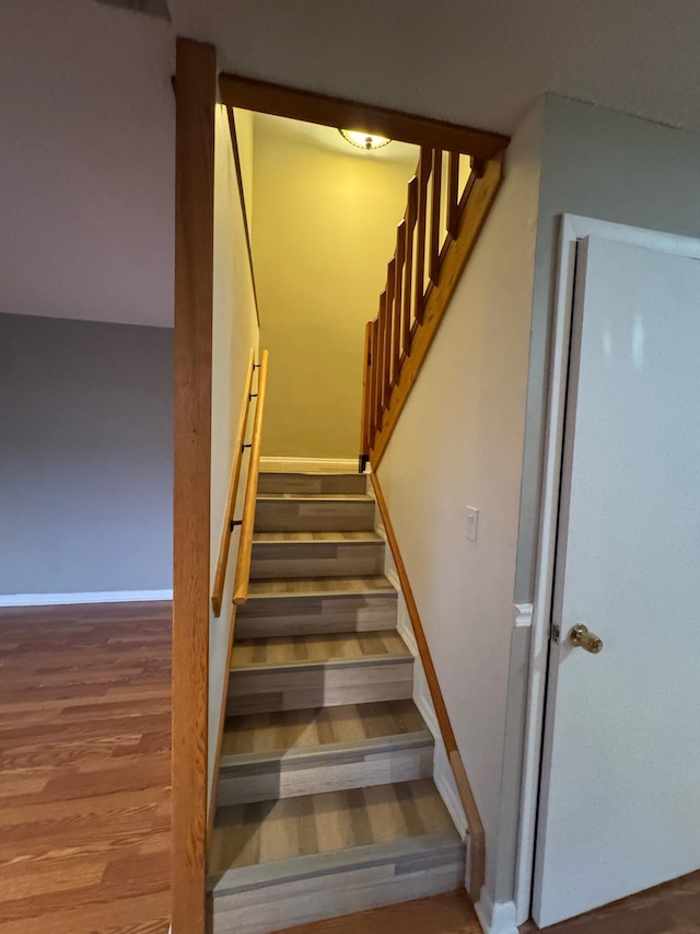 1458 N Lawnwood Cir Unit 23A, Fort Pierce, FL 34950 - stairway with wood finished floors and baseboards