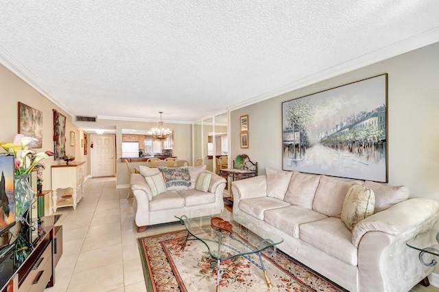 living area featuring crown molding, a notable chandelier, light tile patterned floors, visible vents, and a textured ceiling