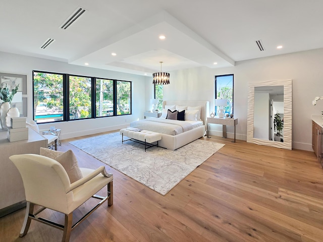 bedroom with light wood-style floors, recessed lighting, and visible vents