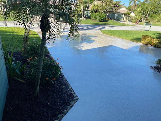 6764 SE Bunker Hill Dr, Hobe Sound, FL 33455 - surrounding community with a yard