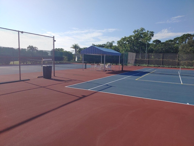 6764 SE Bunker Hill Dr, Hobe Sound, FL 33455 - view of tennis court featuring community basketball court and fence