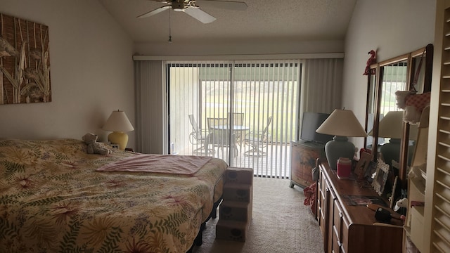 bedroom featuring lofted ceiling, carpet, access to outside, and a textured ceiling