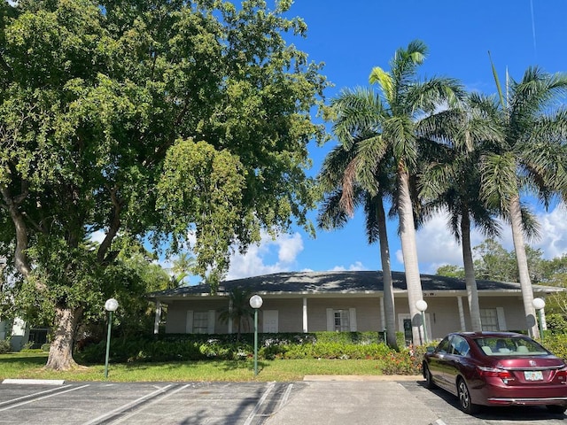 view of property featuring uncovered parking