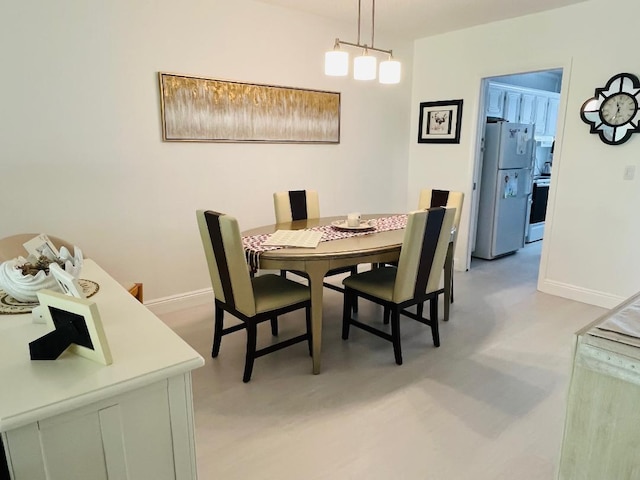 dining room featuring baseboards