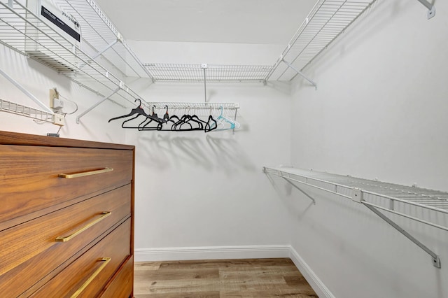 spacious closet with light wood-style floors