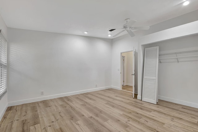 unfurnished bedroom with a closet, light wood-style flooring, and baseboards