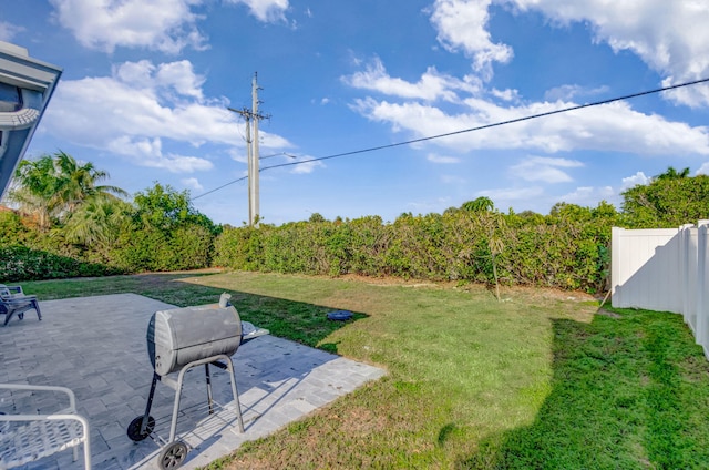 view of yard with a patio area and fence