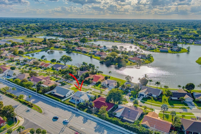 birds eye view of property with a residential view and a water view