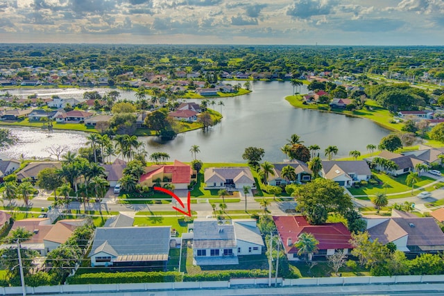 bird's eye view with a water view and a residential view