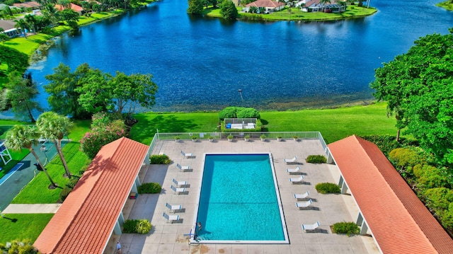 birds eye view of property with a water view