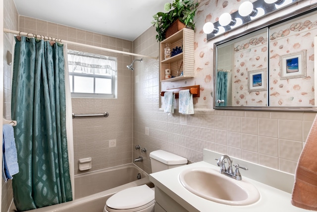 full bath featuring toilet, shower / bath combo, tile walls, and vanity