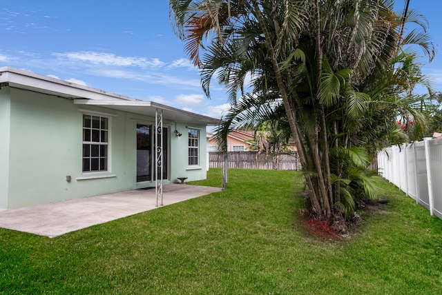 view of yard with a patio and a fenced backyard