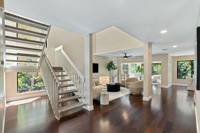 staircase with recessed lighting, ceiling fan, baseboards, and wood finished floors