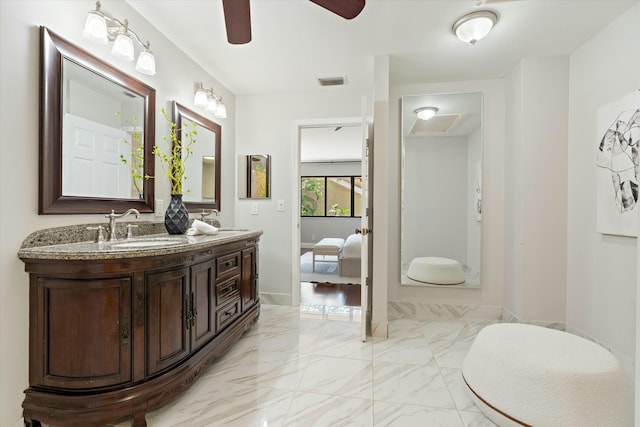 bathroom with double vanity, visible vents, marble finish floor, and a sink